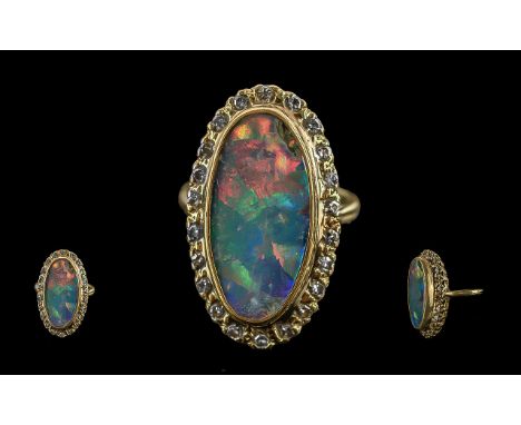 Ladies - Excellent 18ct Gold Diamond and Opal Set Ring, marked 18ct. the large elongated oval opal of pleasing colour, surrou