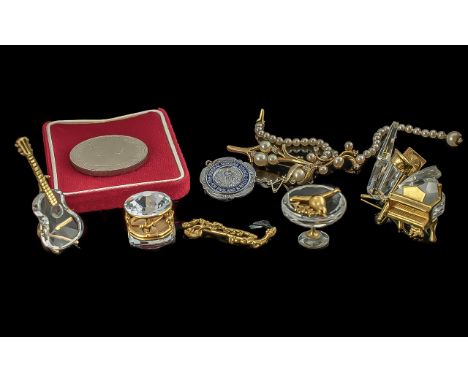 Collection of Swarovski Crystal Miniature Musical Instruments, comprising a piano, guitar, drum, trombone, together with a Sw