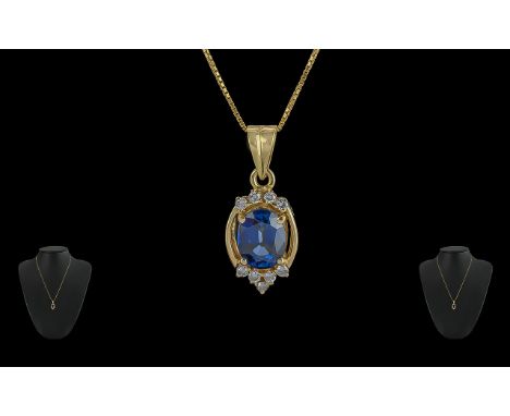 18ct Gold Pleasing Quality Sapphire and Diamond Set Pendant - With attached 18ct Gold Chain. Marked 18ct (750) The Oval Blue 