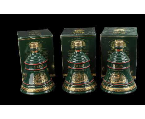 Three Bottles of Bells Old Scotch Whisky Christmas Decanters,  full contents, 8 years old, in original boxes. Dates 1994, and