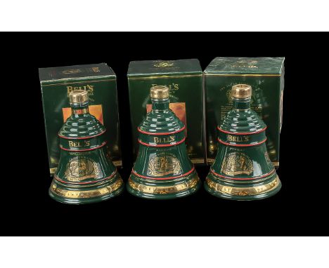 Three Bottles of Bells Old Scotch Whisky Christmas Decanters,  full contents, 8 years old, in original boxes. Dates 1992, 199