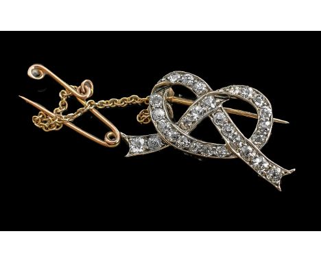 Antique Period - Ladies 18ct Gold Superb and Exquisite Diamond set Ribbon and Bow design small brooch, with safety chain. the