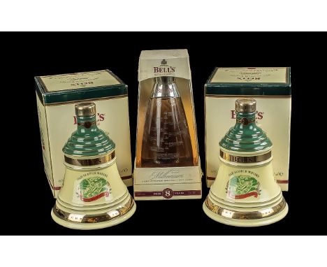 Three Bottles of Bells Old Scotch Whisky Decanters,  full contents, 8 years old, in original boxes. Two Christmas Decanters d