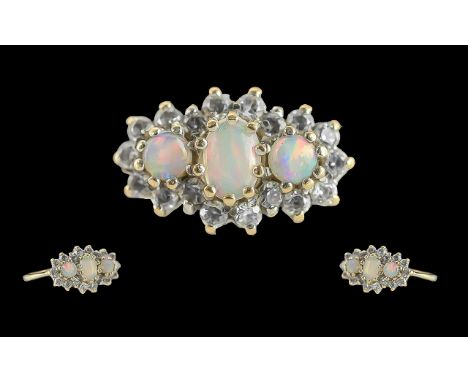 Ladies - pleasing 9ct gold opal and diamond set ring. full hallmark to interior of shank. the 3 opals of good colour, with di