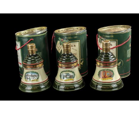 Three Bottles of Bells Old Scotch Whisky Christmas Bells,  full contents, 8 years old, in original tins. Dates 1989, 1990 and
