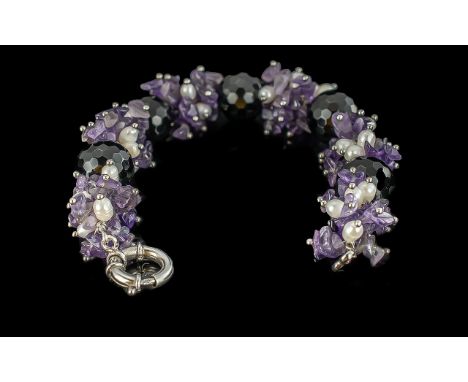 Obsidian Amethyst and Pearl Bracelet, comprising large, faceted, round, black obsidian beads with full clusters of natural am