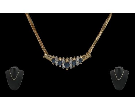 Ladies 14ct Gold Pleasing Design Sapphire &amp; Diamond Set Necklace, marked 14ct.  The boat shaped blue Sapphire of good col