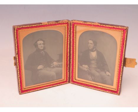 A 19TH CENTURY CASED AMBROTYPE DOUBLE PORTRAIT OF TWO SEATED GENTLEMEN, image 9 x 6.5 cm, case 12 x 9 cm