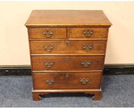 A 19TH CENTURY CHEST OF SMALL PROPORTIONS, having two short above three longer graduated drawers, raised on bracket feet H 89