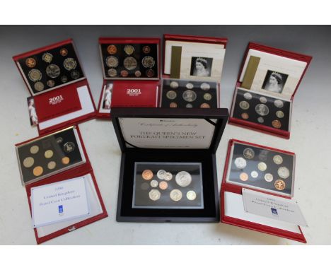 A CASED  'NEW QUEEN'S PORTRAIT' SPECIMEN COIN SET, together with a 1990 Royal Mint proof set, a 1992 example, two 2001 exampl