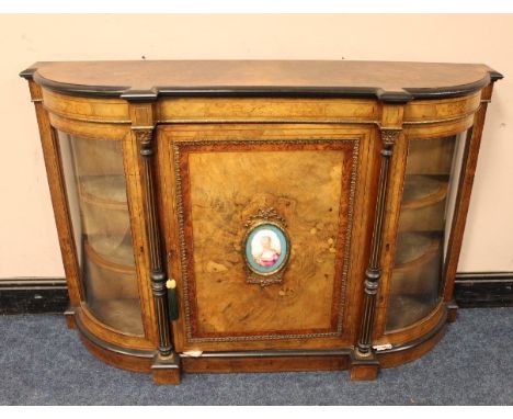 A VICTORIAN WALNUT CROSSBANDED CREDENZA, the single panelled door with a continental oval porcelain plaque featuring portrait