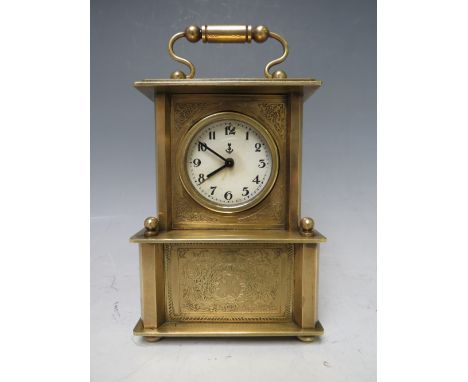 A SMALL BRASS CASED MUSICAL ALARM CLOCK, playing Brahms 'Lullaby For Babies'