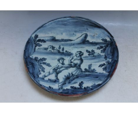 AN  ITALIAN STYLE TIN GLAZE FOOTED DISH WITH PORTRAIT OF MOTHER AND CHILD IN A TYPICAL COUNTRY SCENE, Dia 29 cmCondition Repo