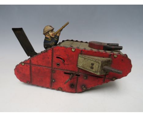 A VINTAGE TINPLATE CLOCKWORK FIRST WORLD WAR TANK, with figure inside, L 24 cm