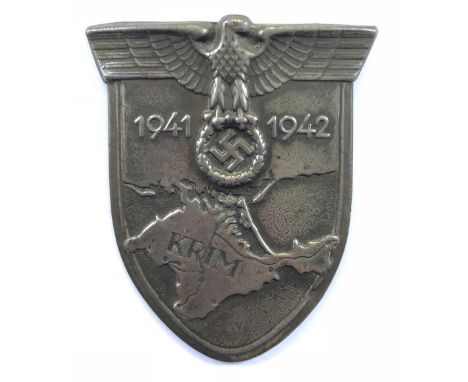 German Third Reich WW2 Army / Waffen SS issue Krim arm shield.A good grey meal example. Eagle and swastika on shield bearing 