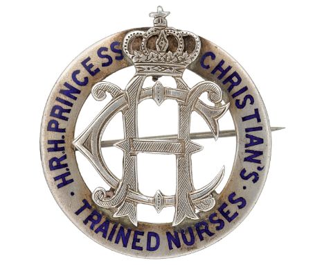 H.R.H. Princess Christian’s District Nurse’s Badge.A rare example of silvered metal with blue enamel inlay. Stout pin to reve