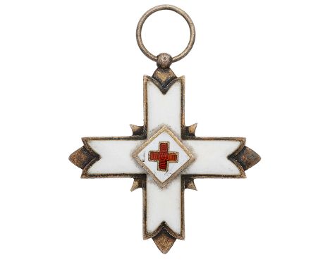 Red Cross or Nursing CrossA good example probably from the Balkan Wars circa 1912-13. White enamelled cross with applied cent