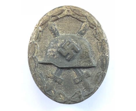 German Third Reich 1939 Wound Badge in silver.A good heavy die-cast example. Needle pin to reverse. Some service wear to fini