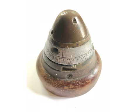 WW1 Turkish Army Artillery Shell Fuse Cap Paper Weight.This fuse cap bears Turkish markings and now mounted onto a turned pie