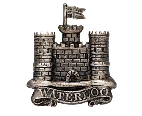 6th Inniskilling Dragoons NCO’s ‘Waterloo’ arm badge.A good die-stamped hollow unmarked silver Castle of Enniskillen with St.