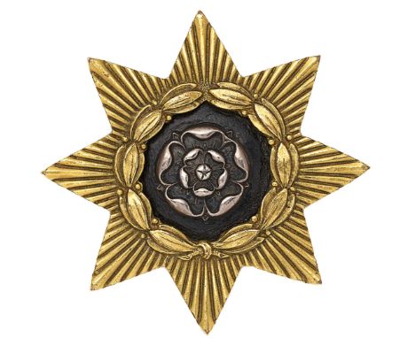 East Yorkshire Regiment Officer’s forage cap badge.A good die-stamped gilt example. Eight pointed star bearing a laurel wreat