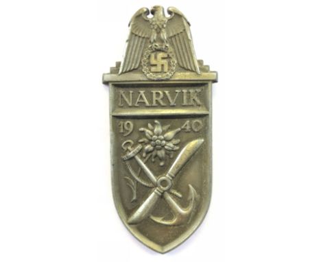 German Third Reich WW2 Army, Waffen SS and Luftwaffe issue Narvik Arm Shield.A good grey metal example. Eagle and swastika su