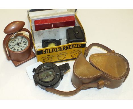 A black enamel metal prismatic compass, 5.5cm diameter, in leather case, (a/f), a WSTS & Co. chronostamp in original box, wit