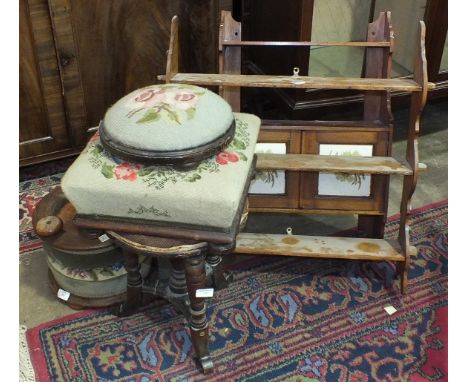 A stained mahogany wall shelf fitted with a pair of doors, 46cm wide, 66cm high, one other wall shelf, a pair of circular pad