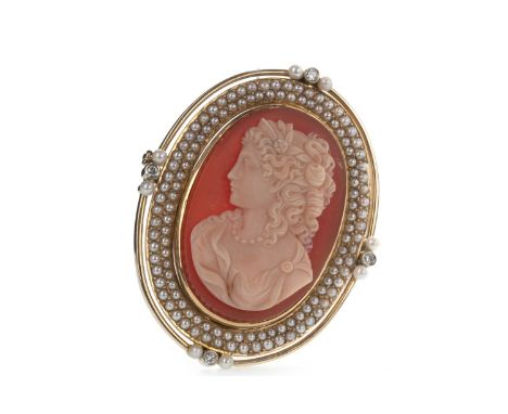 DIAMOND AND PEARL CAMEO BROOCH, depicting a female in profile facing left, within a double halo of seed pearls flanked by fou