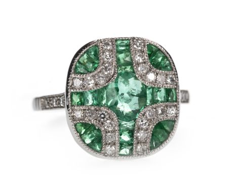 EMERALD AND DIAMOND RING, the cushion shaped bezel set with oval and calibre cut emeralds, interspaced by round brilliant cut