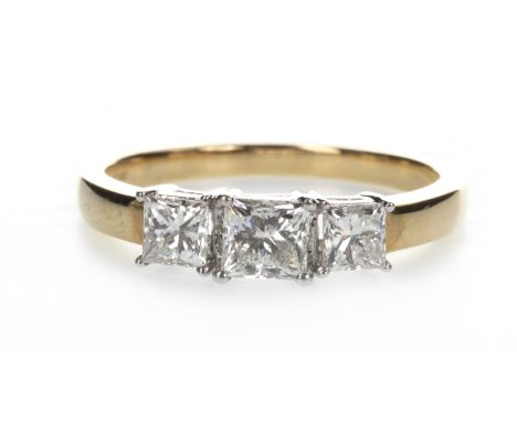 DIAMOND THREE STONE RING, the princess cut diamonds totalling approximately 1.00 carat, in eighteen carat gold, size N 1/2, 3