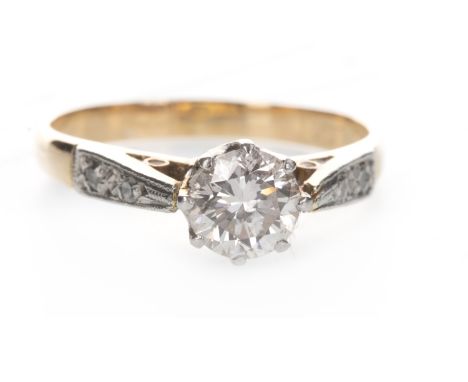 DIAMOND SOLITAIRE RING, the round brilliant cut diamond of approximately 0.58 carats flanked by two diamonds on each shoulder
