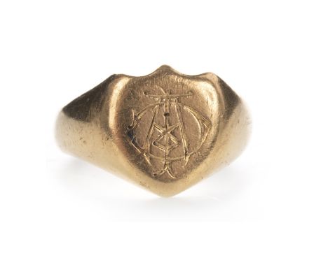 GOLD SIGNET RING, the shield shaped bezel with engraved monogram, marked 18, size L 1/2, 10.4g