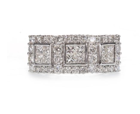 DIAMOND DRESS RING, the three square panels each set with four princess cut diamonds, bordered by round brilliant cut diamond