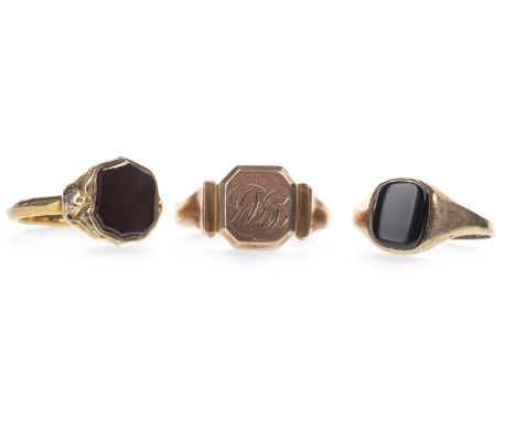 RED HARDSTONE SIGNET RING, set with a shield shaped red hardstone, size O, along with a black hardstone ring, size R 1/2, and