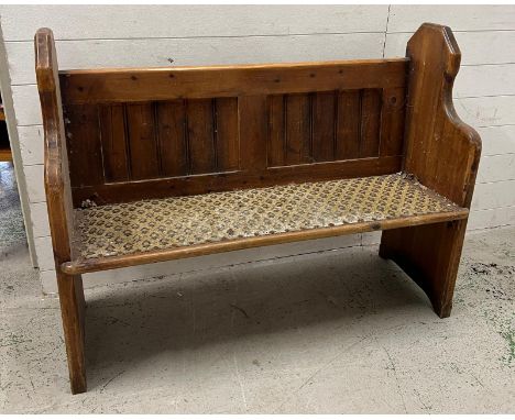 A solid pine church pew (H9cm W124cm D45cm)