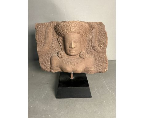 Relief sculpture of portrait head in sand stone on stand (H31cm W32cm)