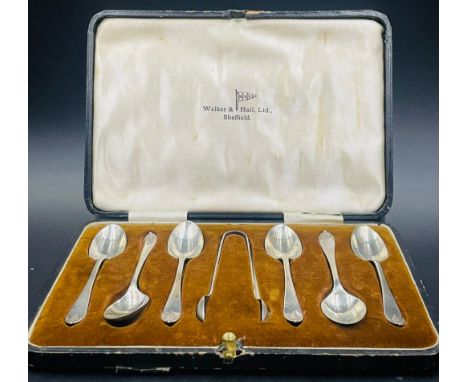 A Walker & Hall six silver teaspoon set with sugar nips in case, hallmarked for Sheffield 1922