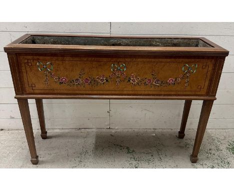 An Edwardian mahogany plant trough, Sheraton revival, the moulded edge housing a Zinc liner, the rectangular front panel pain