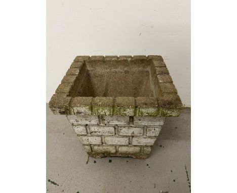 Concrete garden planter with brick design 