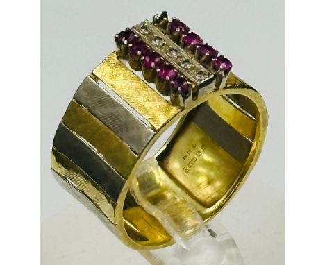 An 18ct contemporary gold ring,makers mark RHB and set with rubies and diamonds. (A single ruby stone is missing)