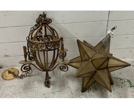A wrought iron four arm ceiling light, this vintage piece has scrolling centre in an acorn shape (56cm top to bottom) along w