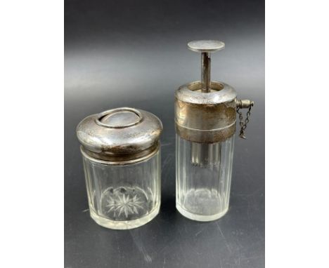 A glass panel sided silver topped cotton bud jar hallmarked for Birmingham 1912 and a panel glassed perfume atomiser with sil