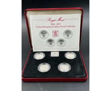 A Royal Mint 1984-1987 United Kingdom £1 Silver Proof Collection