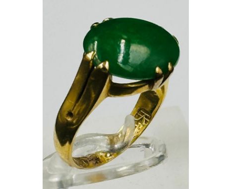 A Jade and gold ring hallmarked for Hong Kong, approximate size L and weight 6.2g