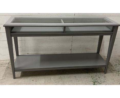 An Ikea console table with glass top (H75cm W132cm D37cm)