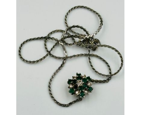 A diamond and emerald pendant on silver chain, ring conversion AF.