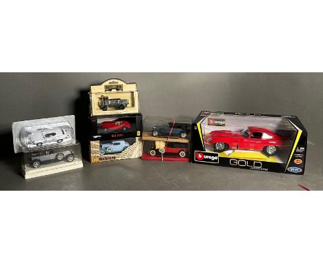 Eight boxed Diecast vehicles, a Burago Jaquar Etype, a Solido Dusenberg and a Solido Renault 