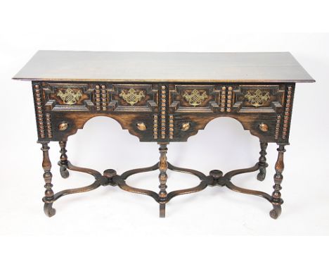 A 17th century style oak side table, 20th century, with two drawers,  on turned legs with X frame stretchers, 71cm H x 127cm 