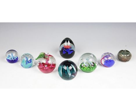 A selection of seven Caithness paperweights comprising; Windfall G17017, Myriad K24433, Ascension W78719, two Reflections fro